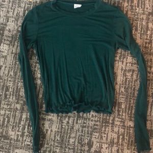 dark green cropped long sleeve shirt.